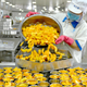 Peaches being put in a can